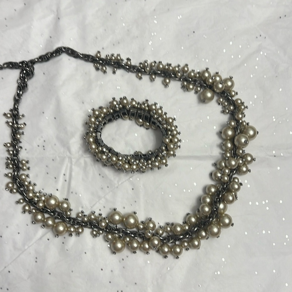 Champagne, pearl necklace, and matching bracelet